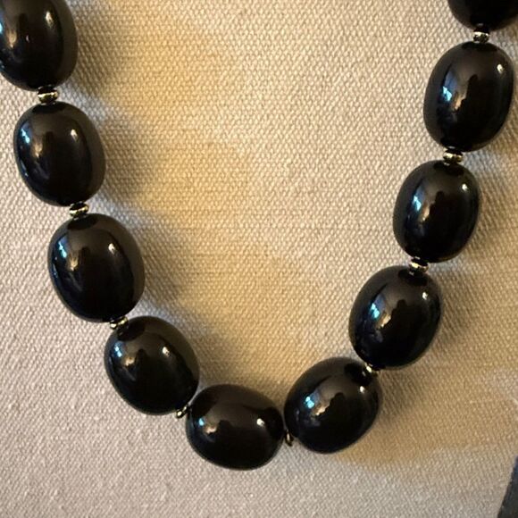 Vintage Monet Signed Black Graduated Bead Necklace with Gold Tone Spacers. - Picture 2 of 5